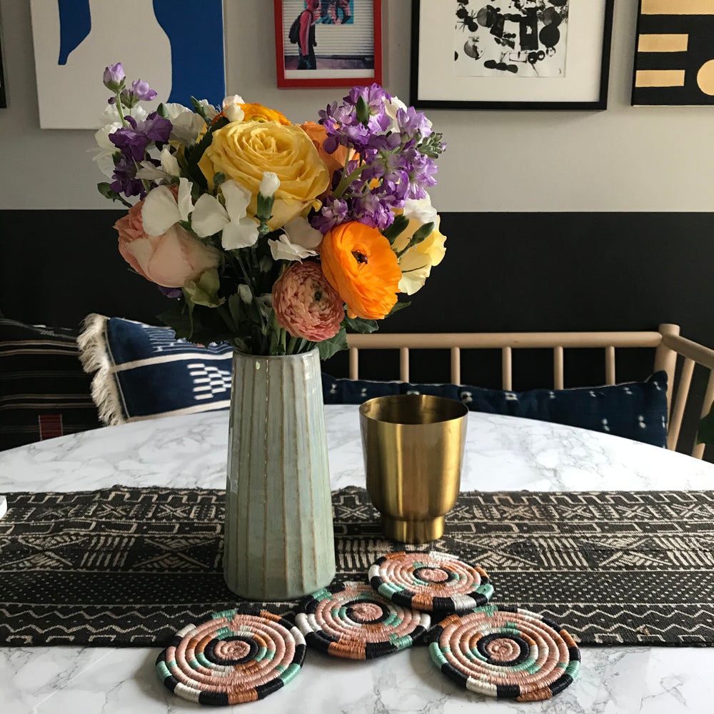 Mudcloth table runner on modern dining table, and and with mudcloth pillows. Perfect for holiday gifts and housewarming gifts, and wedding registries. Fair Trade made in Mali Africa.