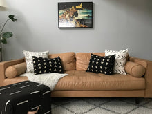 Load image into Gallery viewer, Handcrafted white mudcloth pillows with minimalist designs styled on mid-century Modern couch. Modern pillows made in USA, designed in Mali.
