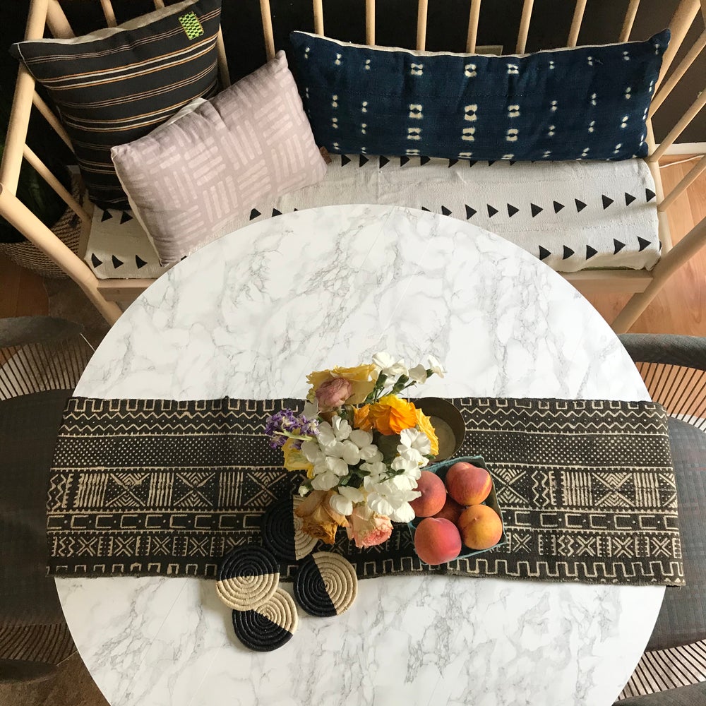 Mudcloth table runner on modern dining table, and and with mudcloth pillows. Perfect for holiday gifts and housewarming gifts, and wedding registries. Fair Trade made in Mali Africa.