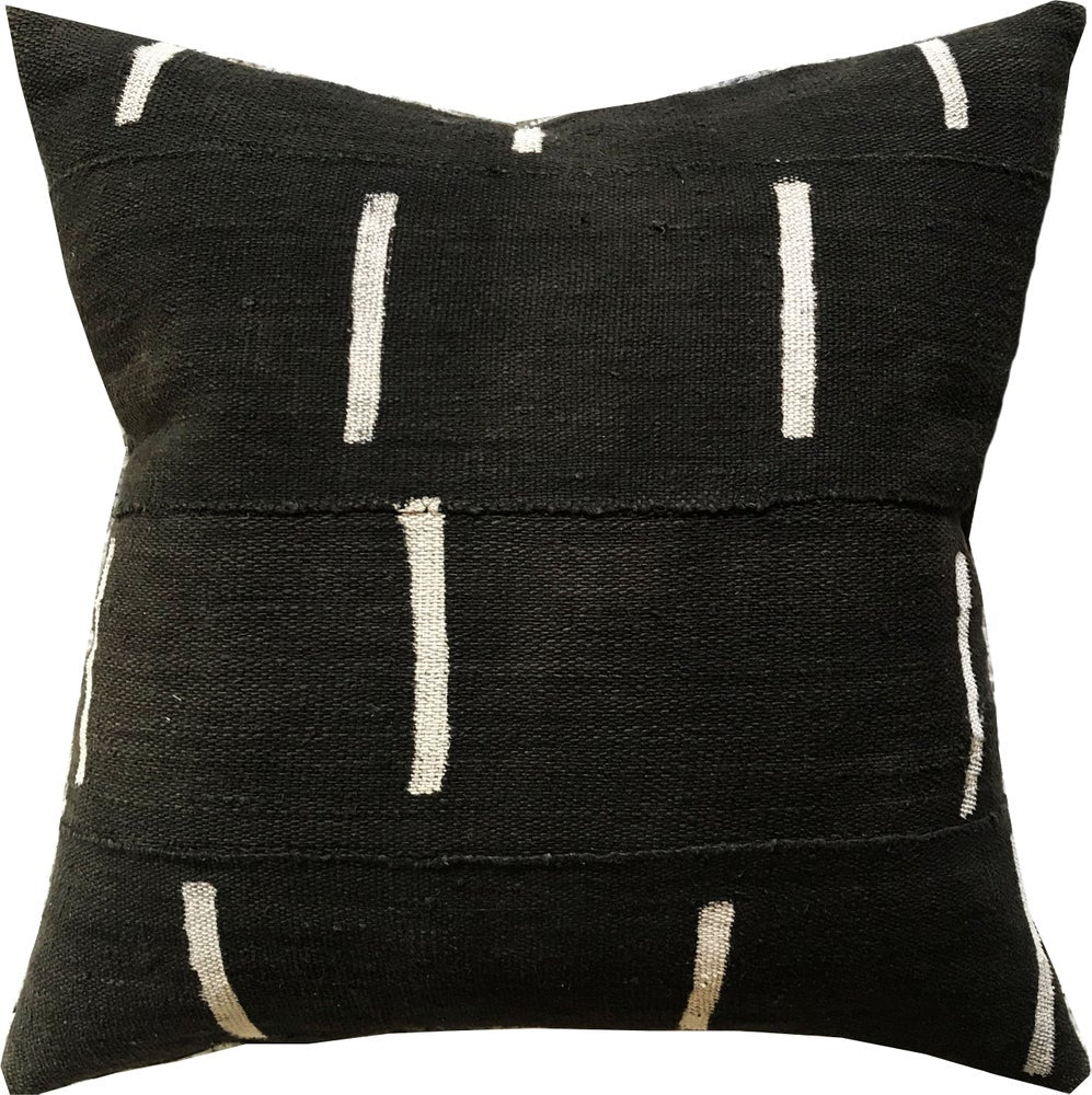 Handcrafted African mudcloth pillows in black with white geometric designs.