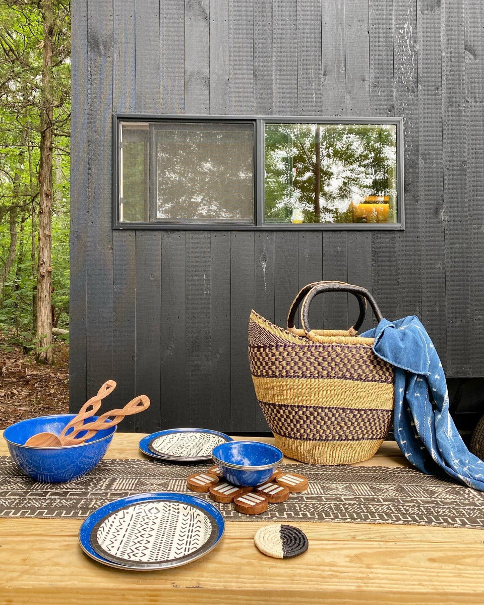 Fair Trade home goods made in Uganda, Sustainable African salad servers for housewarming and wedding registry gifts. Handcarved acacia wood and bone on mudcloth table runner.