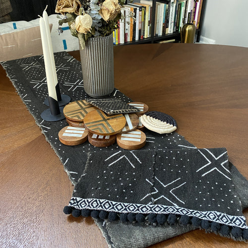 Mudcloth table runner on modern dining table, and and with mudcloth pillows. Perfect for holiday gifts and housewarming gifts, and wedding registries. Fair Trade made in Mali Africa.