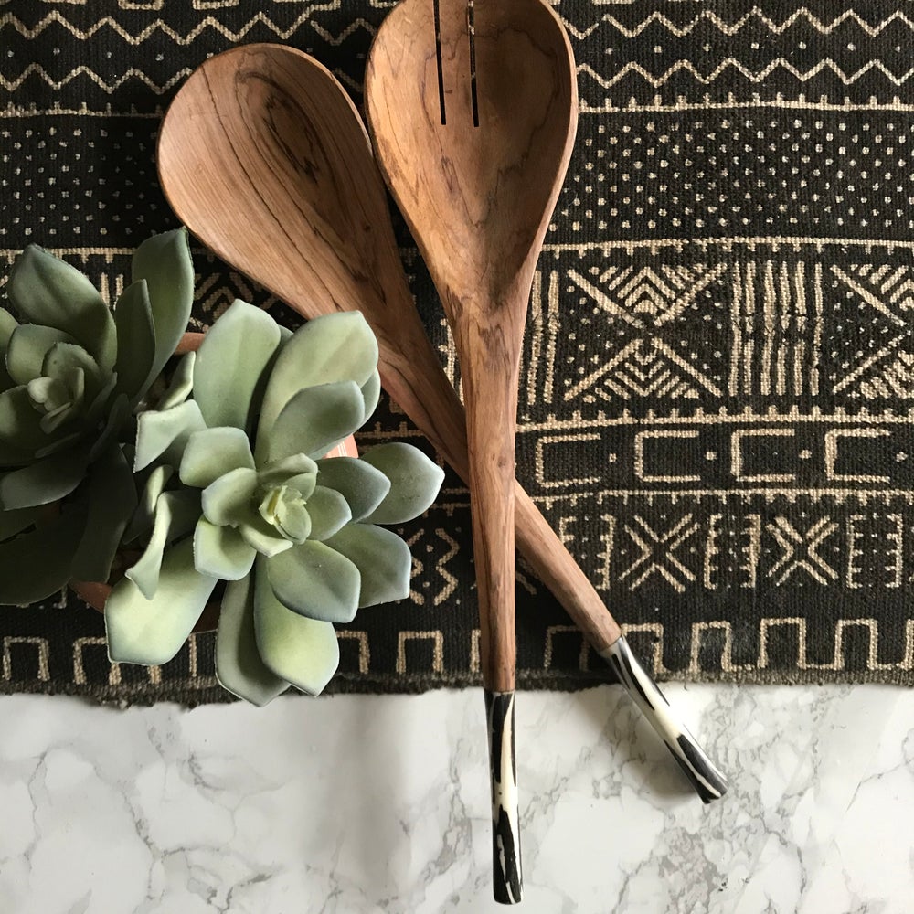 Fair Trade home goods made in Uganda, Sustainable African salad servers for housewarming and wedding registry gifts. Handcarved acacia wood and bone on mudcloth table runner.