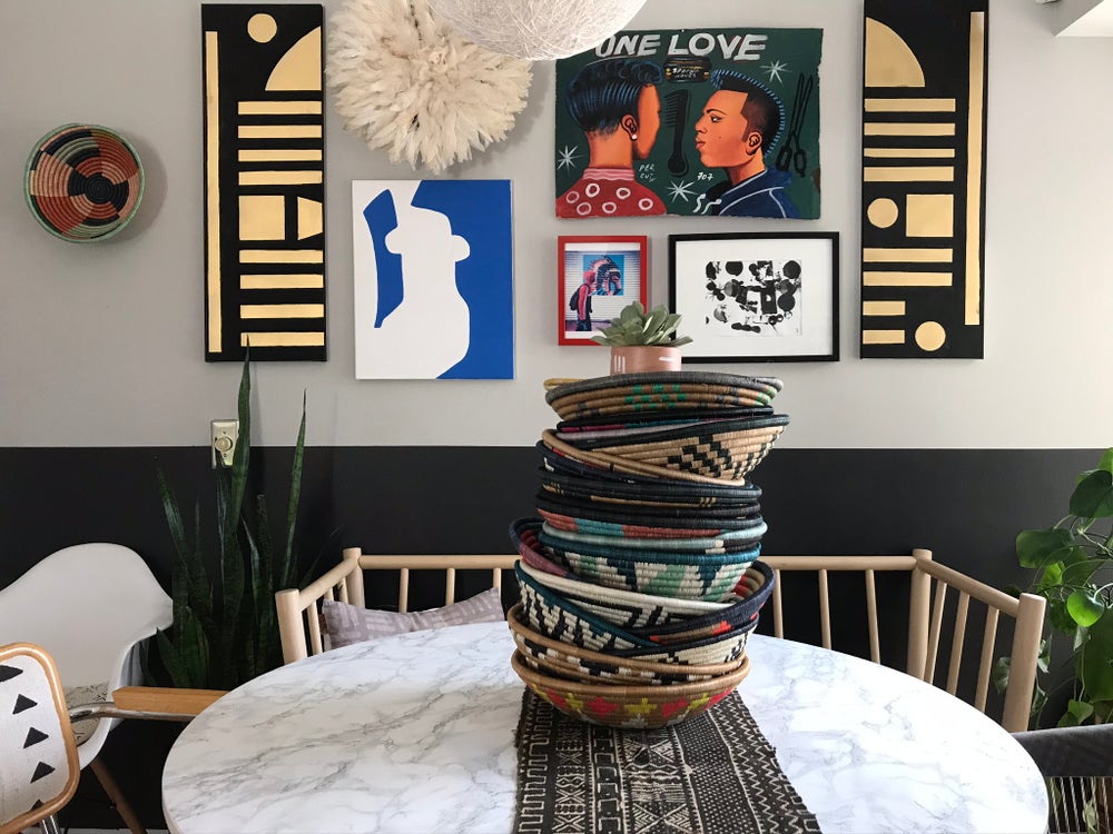 African basket, Fair Trade made in Uganda. Decorative and African art on table with mudcloth pillows.