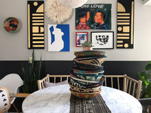 Load image into Gallery viewer, African basket, Fair Trade made in Uganda. Decorative and African art on table with mudcloth pillows.
