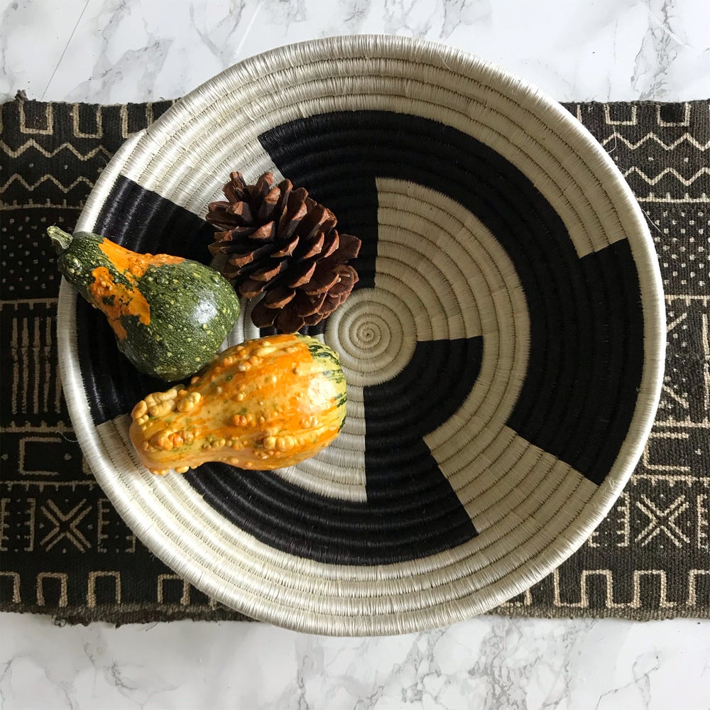 African baskets, Fair Trade made in Uganda. Decorative and African art on modern dining table with mudcloth table runner.