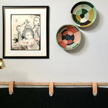Load image into Gallery viewer, African baskets, Fair Trade made in Uganda and Rwanda. Decorative and African art on gallery wall in modern bedroom.
