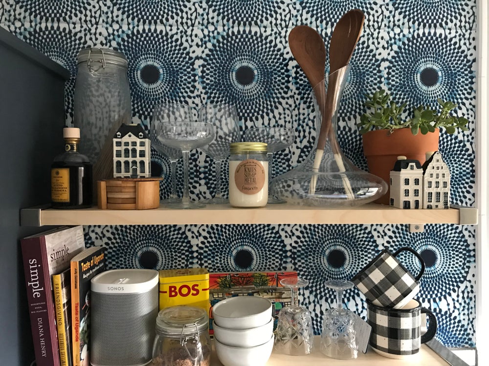 Bohemian chic blue wallpaper in the kitchen with open shelving. Inspired by classic African wax print designs. Also perfect fro mudrooms, entryways, and bedrooms.