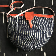 Load image into Gallery viewer, Handcrafted woven raffia and leather tote made in Uganda, Fair Trade. Perfect for daily essentials and accessorizing.
