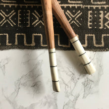 Load image into Gallery viewer, Handcrafted Fair Trade serveware and home goods made in Uganda, Sustainable African salad servers for housewarming and wedding registry gifts. Handcarved acacia wood and bone on mudcloth table runner.
