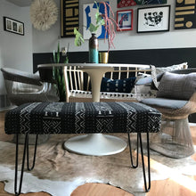 Load image into Gallery viewer, Handcrafted and minimalist mudcloth bench. Made in industrialist style with hairpin legs. African art and juju hat in background with Platner dining chairs.
