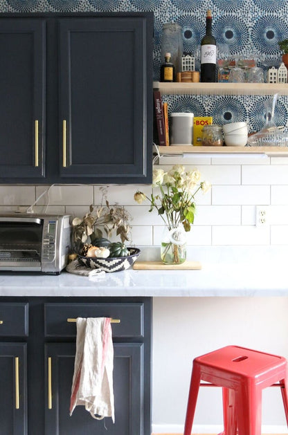 Bohemian chic blue wallpaper in the kitchen with open shelving. Inspired by classic African wax print designs. Also perfect fro mudrooms, entryways, and bedrooms.