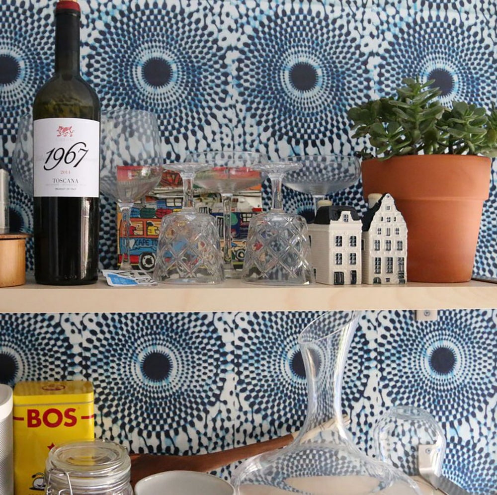 Bohemian chic blue wallpaper in the kitchen with open shelving. Inspired by classic African wax print designs. Also perfect fro mudrooms, entryways, and bedrooms.