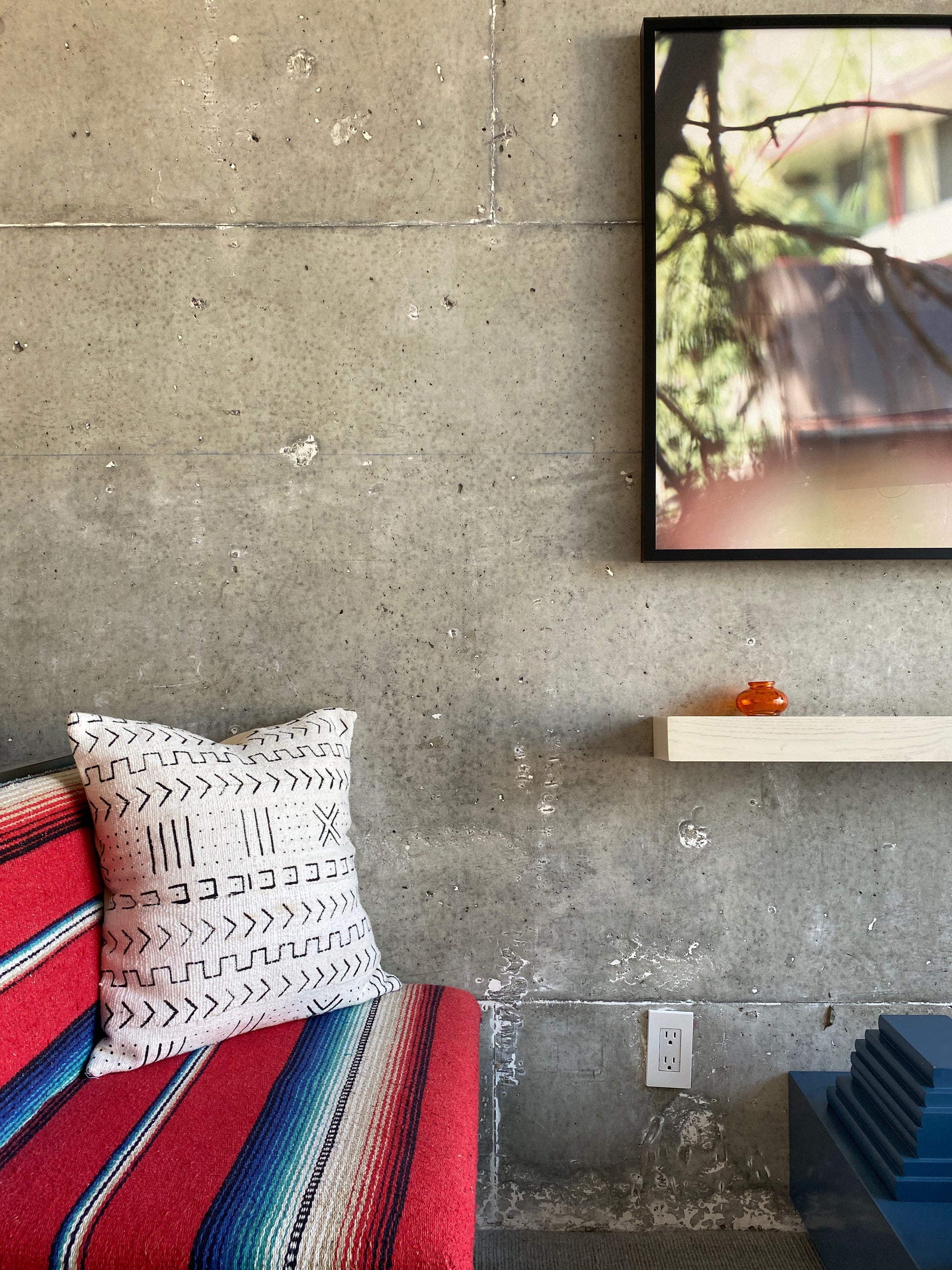 White xN Studio mudcloth pillow on modern Serape textile chair at the Line Hotel in Los Angeles, California. 