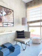 Load image into Gallery viewer, Black mudcloth pillows with minimalist designs styled with African art and modern furniture. Modern pillows made in USA, designed in Mali. Seen here in modern Los Angeles loft apartment, boutique hotel..
