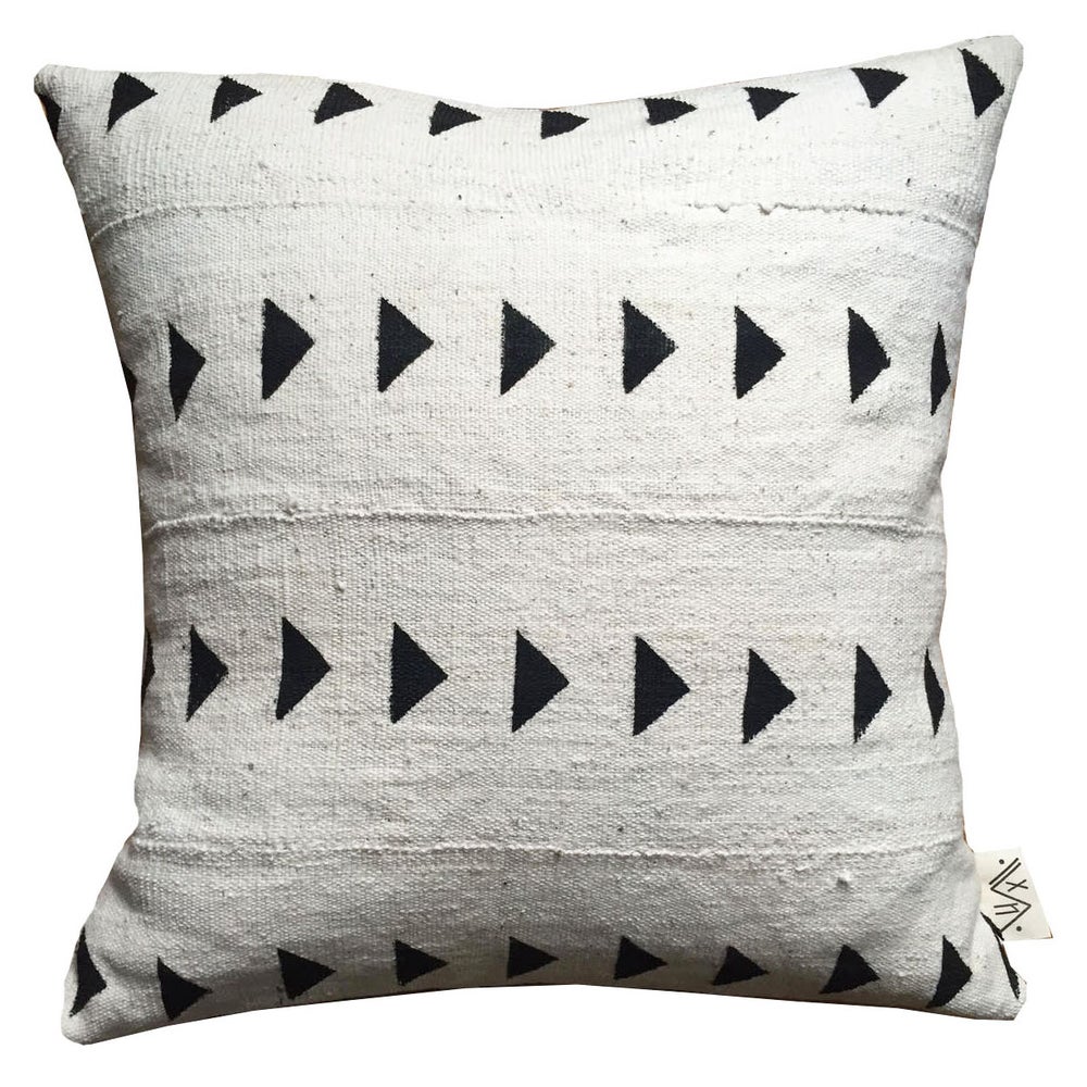 Handcrafted African mudcloth pillow in minimalist white for modern homes. Black and white home textiles