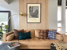 Load image into Gallery viewer, Batik and mudcloth textile home goods in modern Boho home, pillows made in Tanzania. African art.
