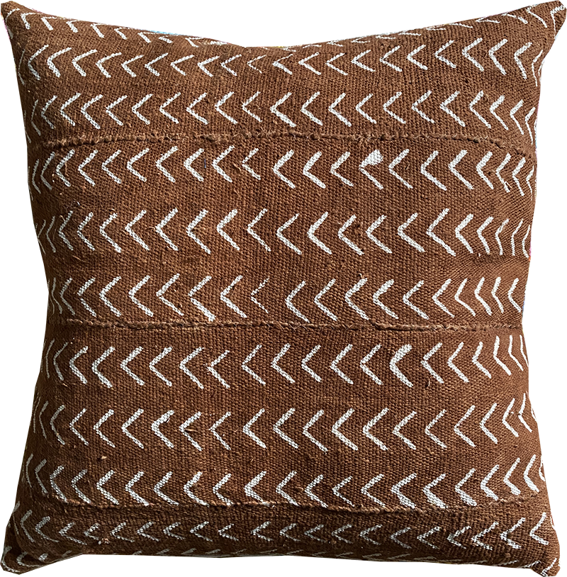 Sienna brown mudcloth pillows with minimalist geometric designs. Modern pillows made in USA, designed in Mali. Seen here with African art.