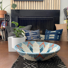 Load image into Gallery viewer, African baskets, Fair Trade made in Uganda and Rwanda. Decorative and African art on gallery wall with mudcloth pillows and table runner.

