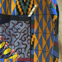 Load image into Gallery viewer, Detail of Handcrafted African wax print apron made in Uganda. Perfect for housewarming and wedding gitfs. Excellent for entertaining guests during the holidays, Thankgiving, Christmas, and more.
